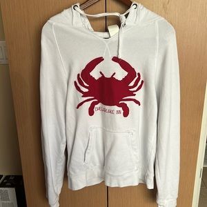 White hooded pullover sweatshirt with red crab design